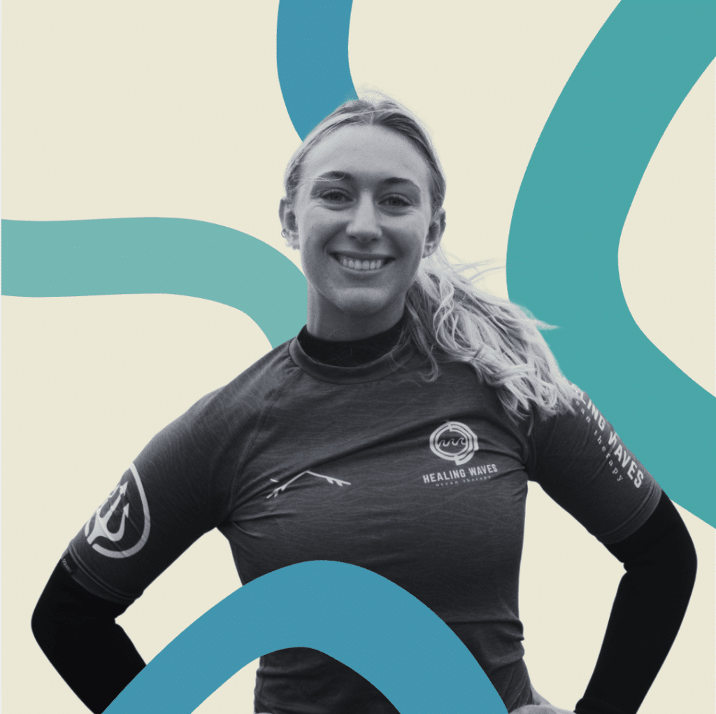 Smiling woman wearing Healing Waves ocean therapy shirt